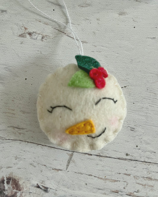 Felt snowman ornament with leaves, smiling snowman