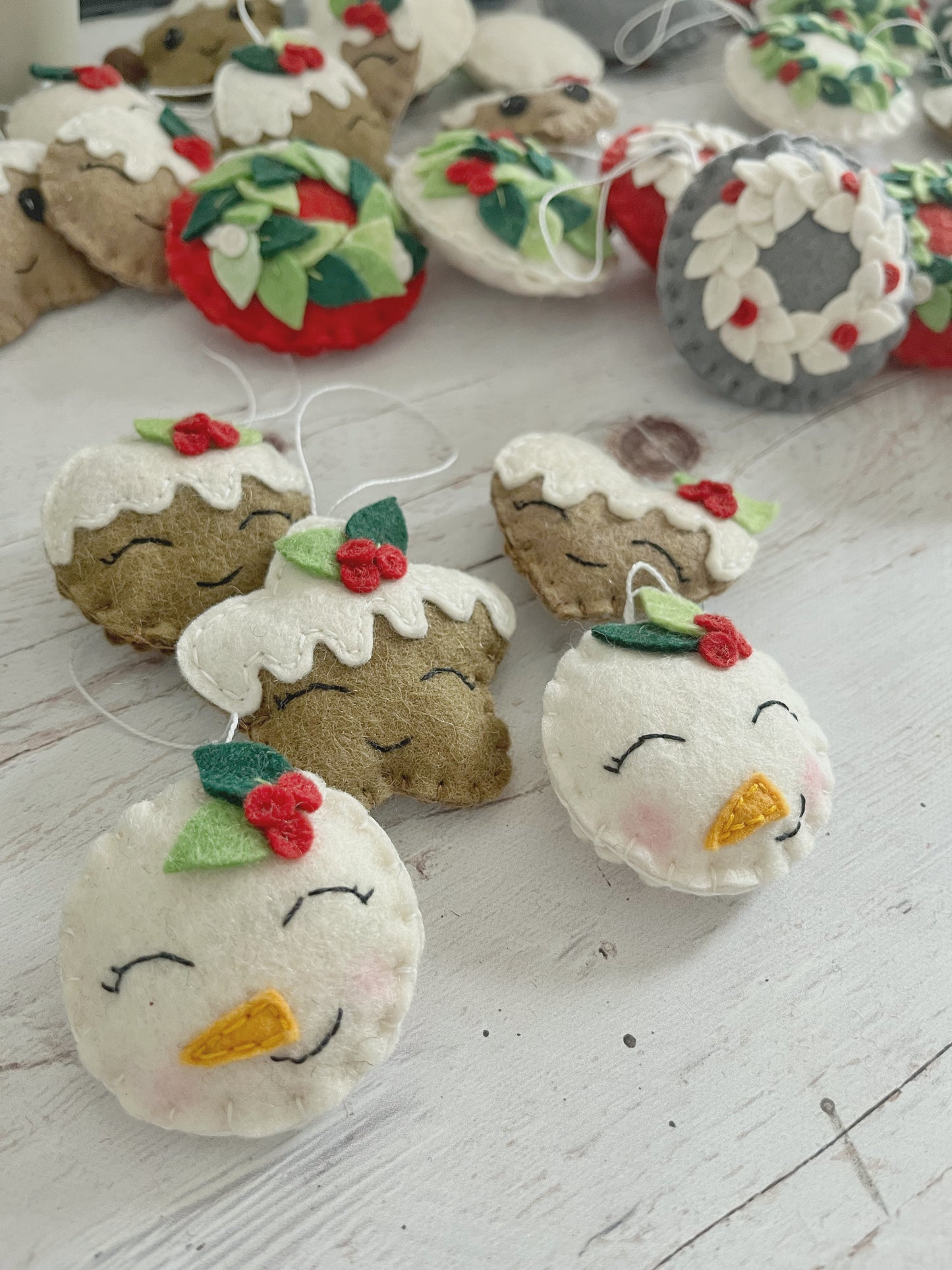 Felt snowman ornament with leaves, smiling snowman