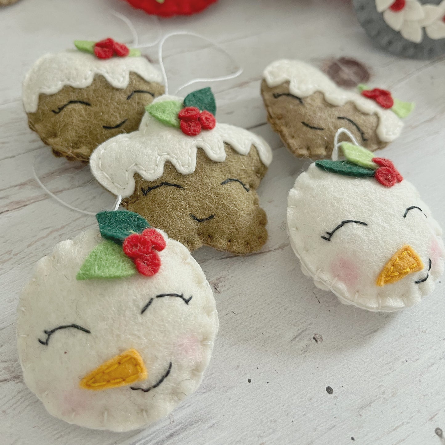 Felt snowman ornament with leaves, smiling snowman