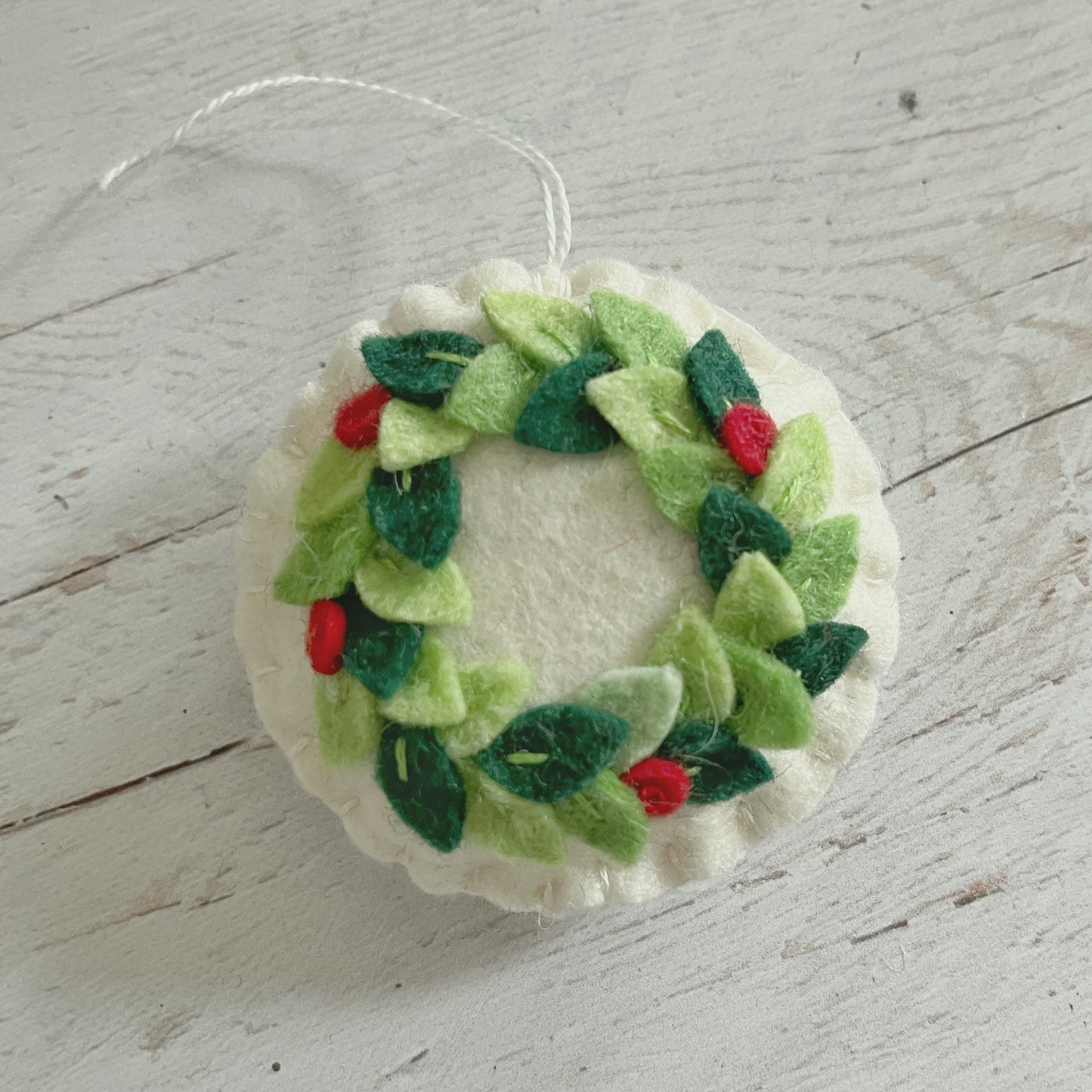 Felt Christmas round ornament with wreath leaves